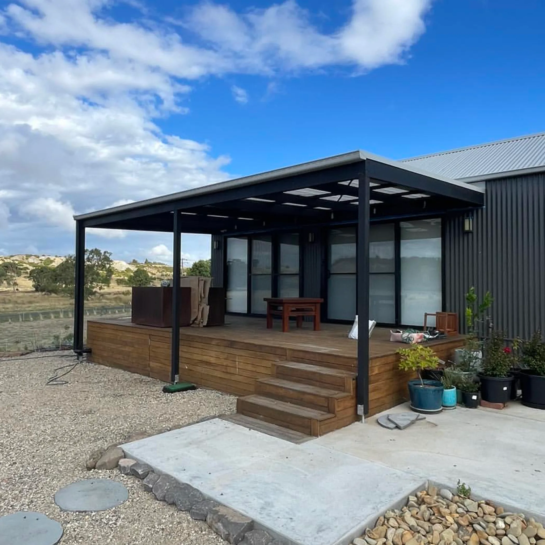 covered pergola with timber decking