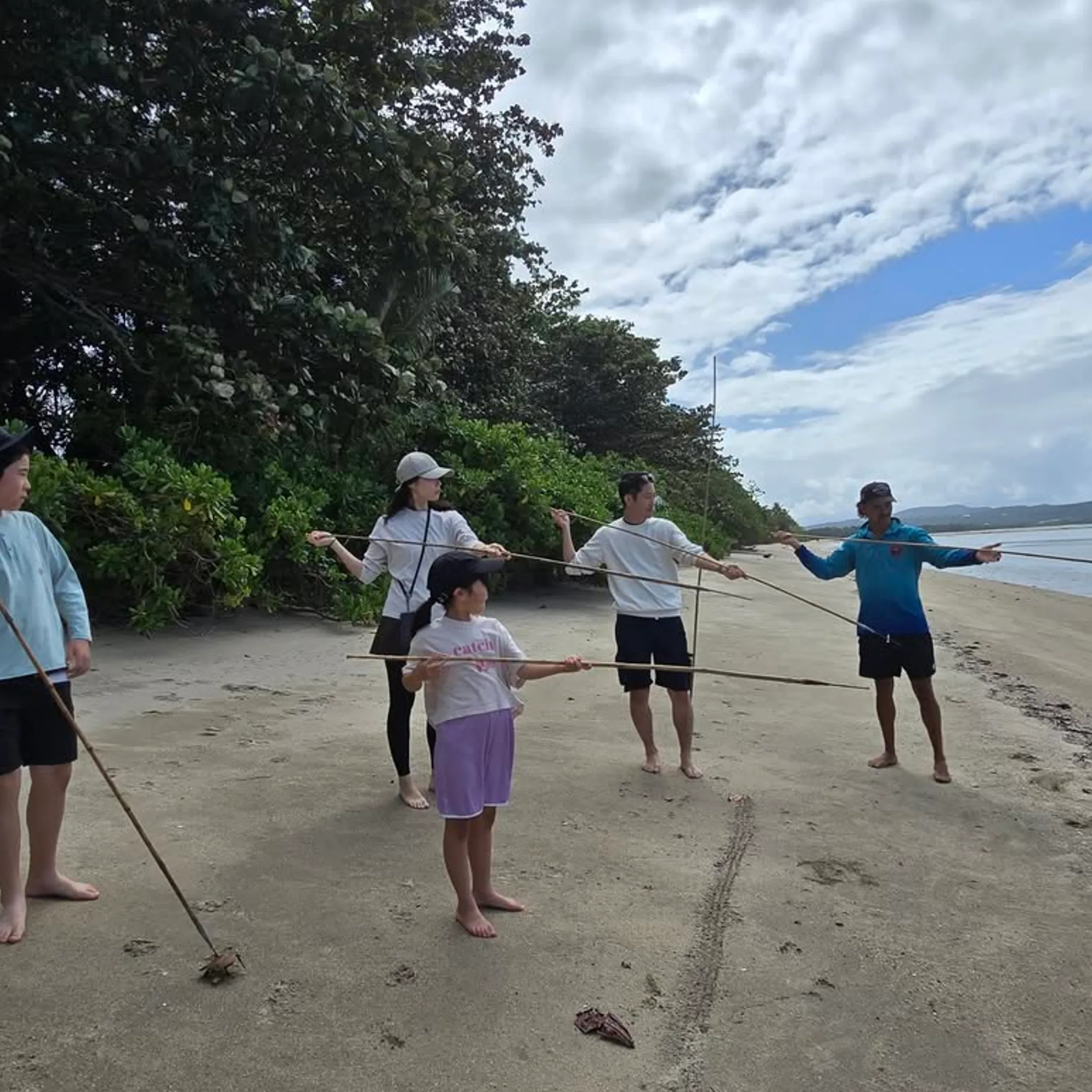 people practicing traditional hunting-tool skills