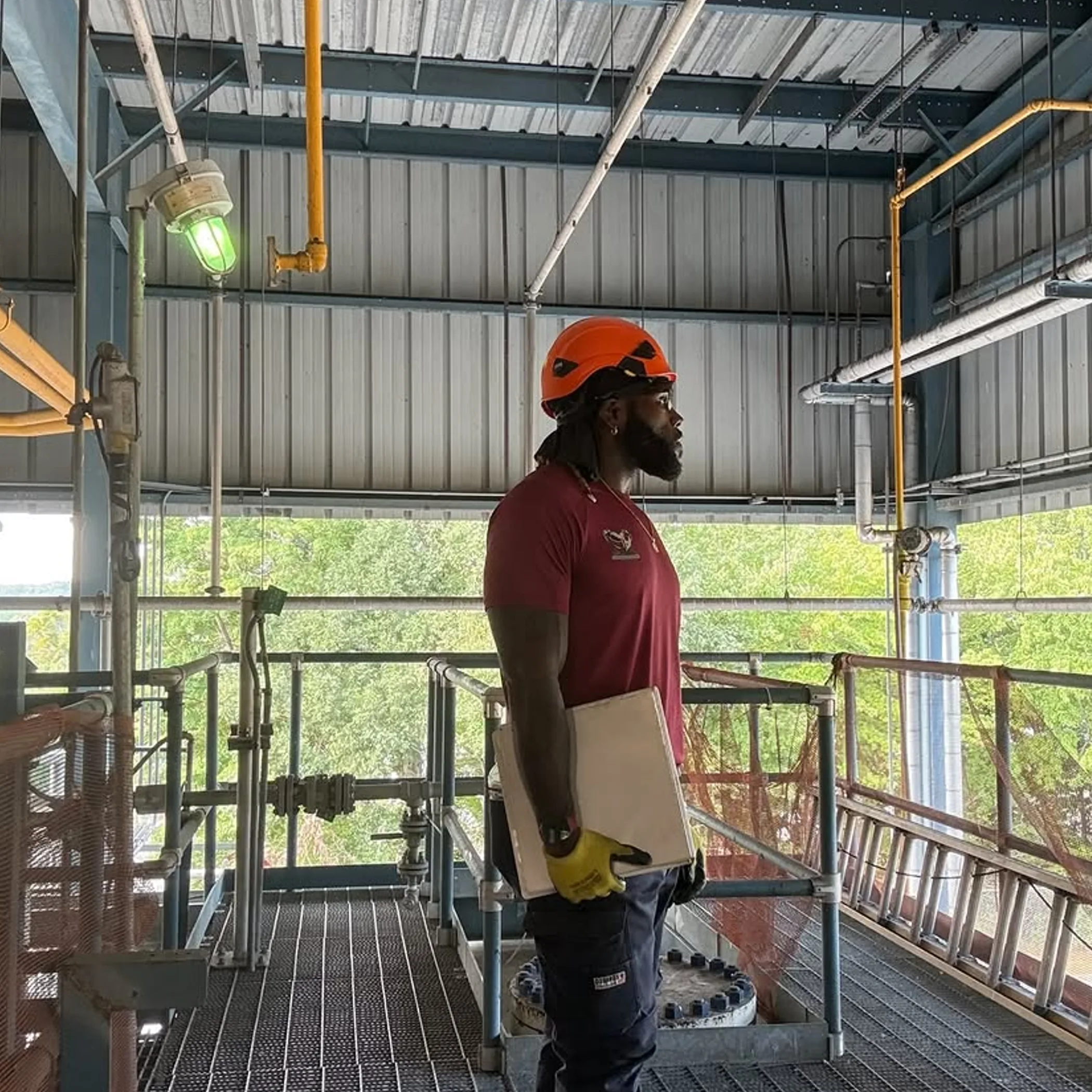 rope-access professional in industrial infrastructure